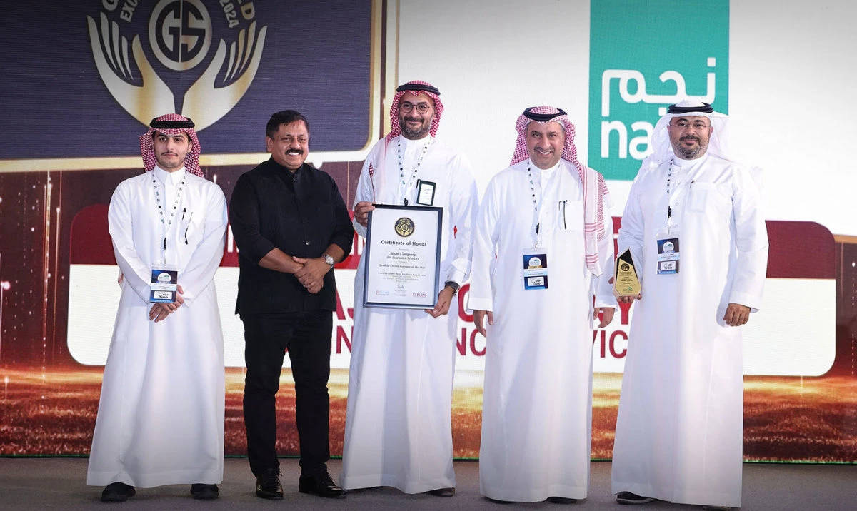 Senior management members of Najm receive the award in Riyadh.