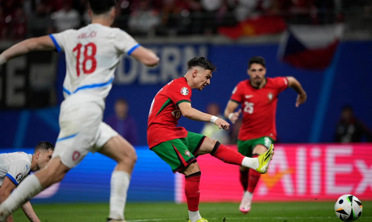 Portugal's Francisco Conceicao, centre, scores his side's second goal during a Group F match between Portugal and Czech Republic at the Euro 2024 soccer tournament in Leipzig, Germany, Tuesday, June 18, 2024. (AP)