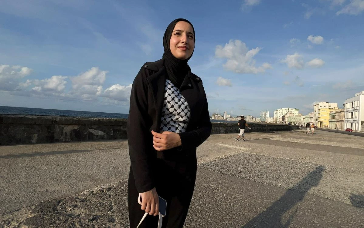Samar Alghoul, 21, poses for a picture during an interview with AFP in Havana on June 2, 2024. (AFP)