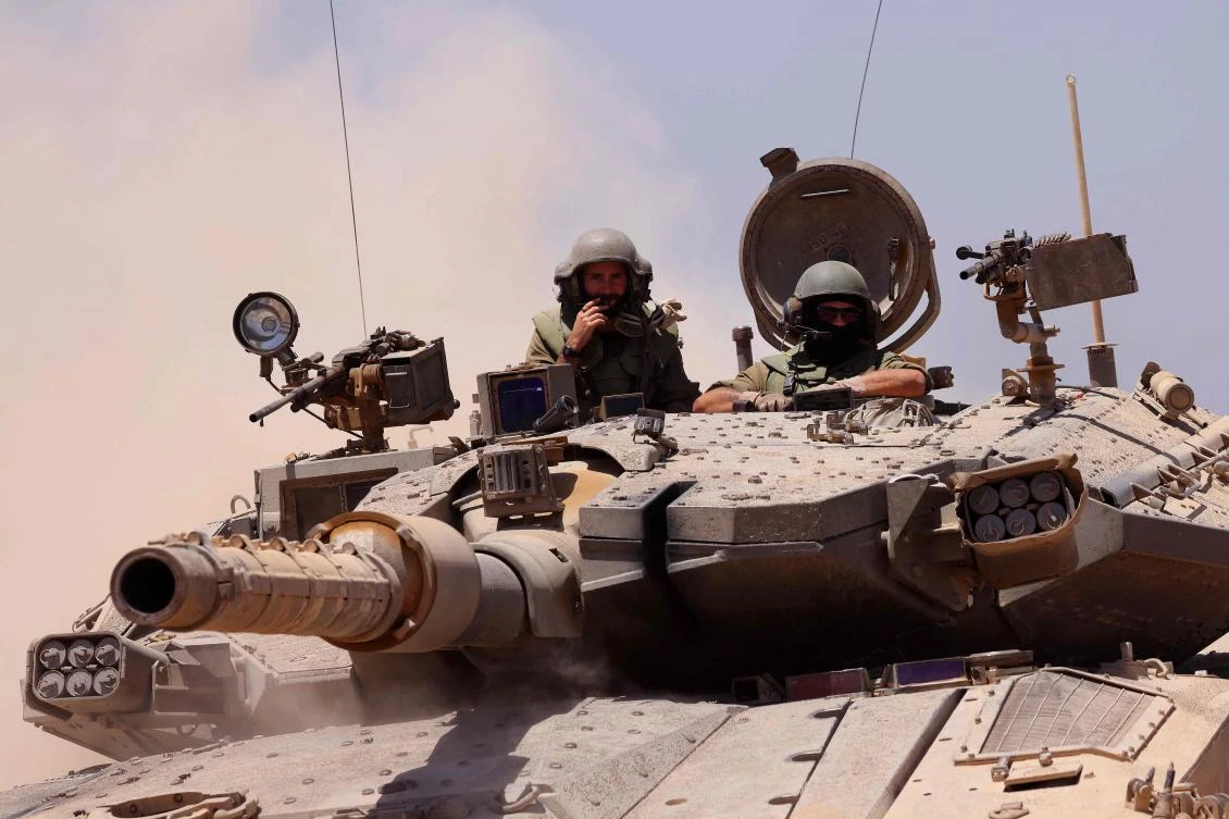 An Israeli army tank rolls to take position in an area along Israel's southern border with the Palestinian Gaza Strip on Jun. 18, 2024. (AFP)
