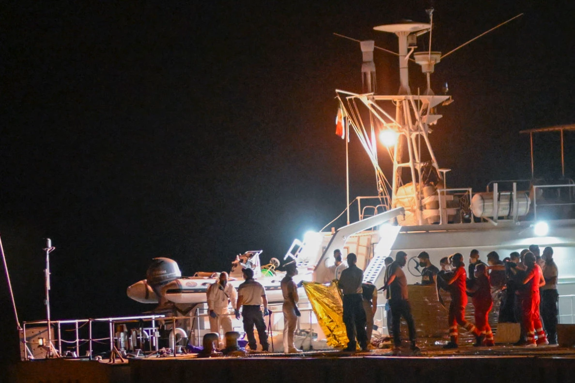 The bodies of some of the 64 migrants missing in the Mediterranean Sea after their ship wrecked off Italy's southern coast are disembarked at the Italian southern port-city of Roccella Ionica, early Wednesday, June 19, 2024. The Italian coast guard on Thursday recovered 12 bodies from a weekend shipwreck in the Ionian Sea off the southern Italian coast line, bringing to 20 the number of known victims. Dozens more were missing and presumed dead. (AP)