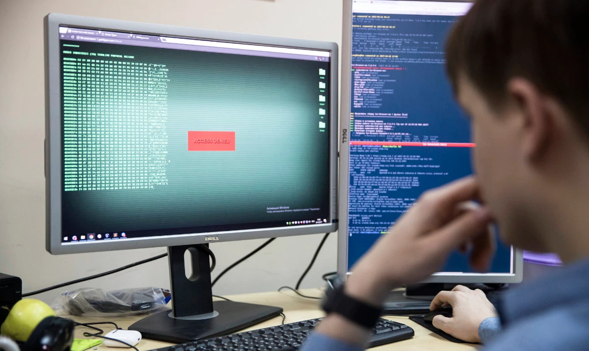 An employee of Global Cyber Security Company Group-IB develops a computer code in an office in Moscow, Russia. (AP/File)
