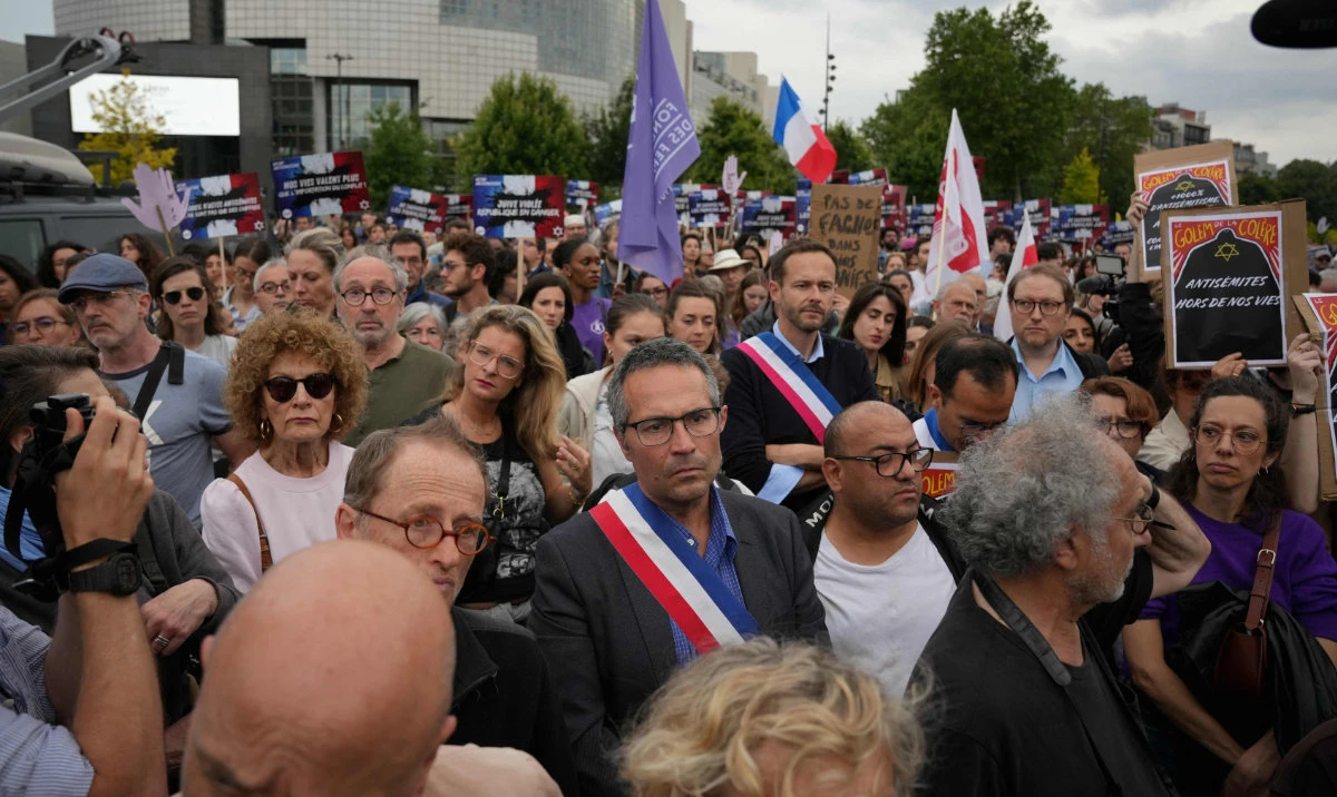 Protesters attend a demonstration called by associations including SOS Racisme and the Women's Foundation to denounce anti-semitism, in Paris on June 20, 2024, after the alleged anti-semetic gang rape of a 12-year-old girl in Paris' suburb of Courbevoie. (AFP)