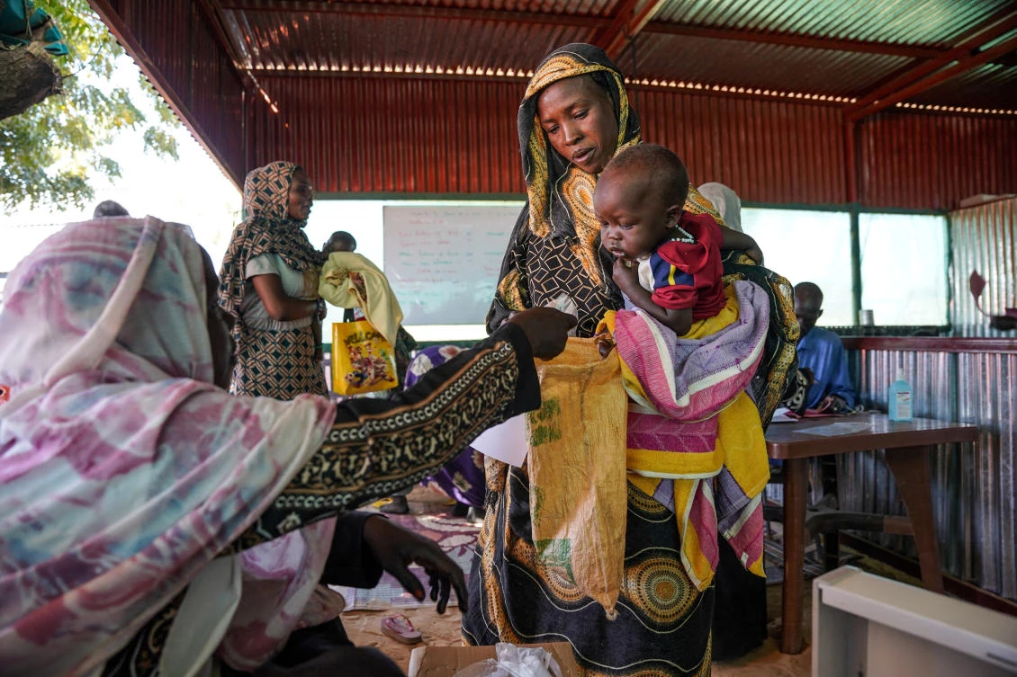 A handout photograph, shot in January 2024, shows a woman and baby at the Zamzam displacement camp, close to El Fasher in North Darfur, Sudan. (Reuters/Files)
