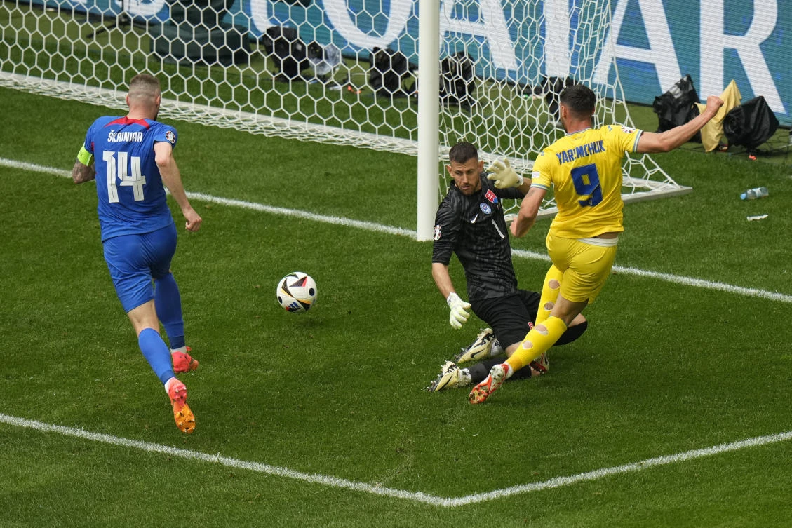 Ukraine’s Roman Yaremchuk scores his side’s second goal against Slovakia’s goalkeeper Martin Dubravka during their Group E match at the Euro 2024 tournament in Duesseldorf on Jun. 21, 2024. (AP)