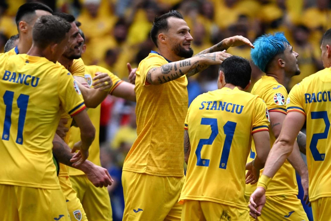 Romania’s players celebrate their win at the end of their UEFA Euro 2024 Group E match against Ukraine at the Munich Football Arena in Munich on Jun. 17, 2024. (AFP)