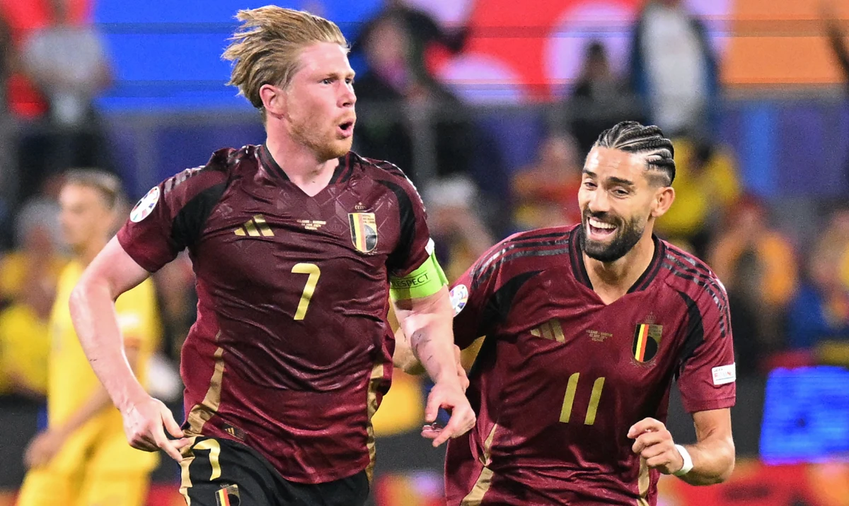 Belgium's midfielder Kevin De Bruyne (L) celebrates scoring his team's second goal with his teammate Belgium's forward Yannick Carrasco during the UEFA Euro 2024 Group E football match between Belgium and Romania at the Cologne Stadium in Cologne on June 22, 2024. (AFP)