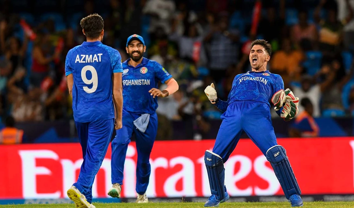 Afghanistan's Rahmanullah Gurbaz (R) celebrate his team's win of the ICC men's Twenty20 World Cup 2024 Super Eight cricket match between Afghanistan and Australia at Arnos Vale Stadium in Arnos Vale, Saint Vincent and the Grenadines on June 22, 2024. (AFP)