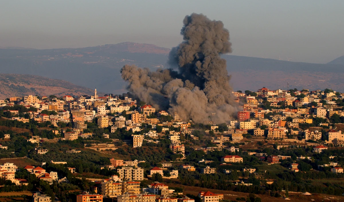 Black smoke billows following an Israeli air strike that targeted a house in the southern Lebanese village of Khiam near the Lebanese-Israeli border on June 21, 2024. (AFP)