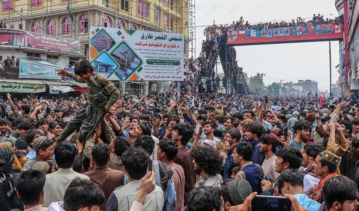 Afghan fans celebrate Afghanistan's win against Bangladesh during super eight match at the ICC T20 Cricket World Cup 2024, in Khost on June 25, 2024. (AFP)