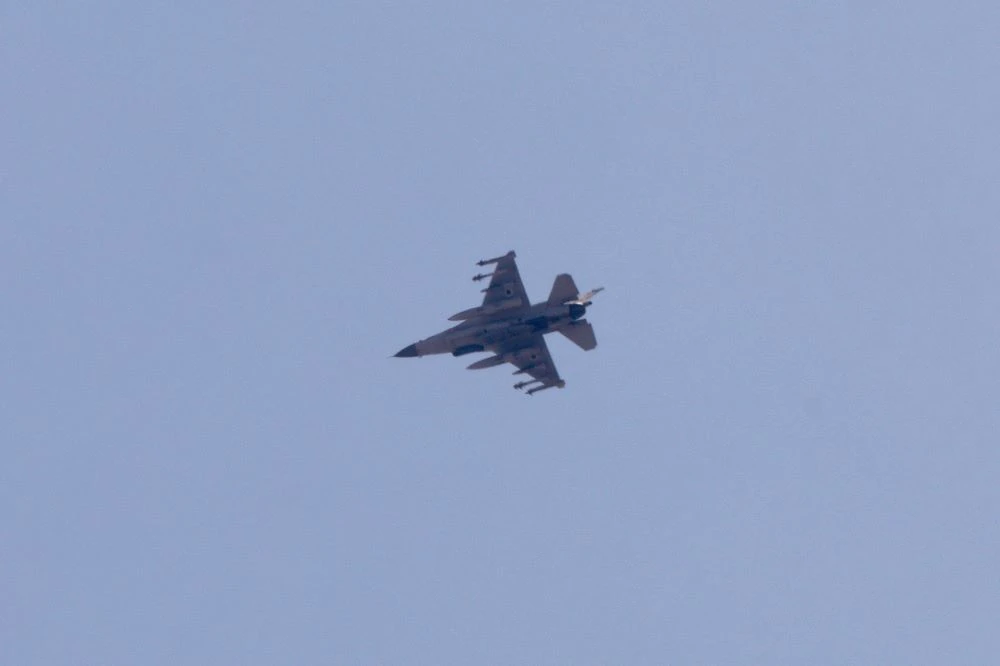 An Israeli air force F-16 Jet fighter aircraft flies over the border area between northern Israel and southern Lebanon on June 25, 2024. (AFP)