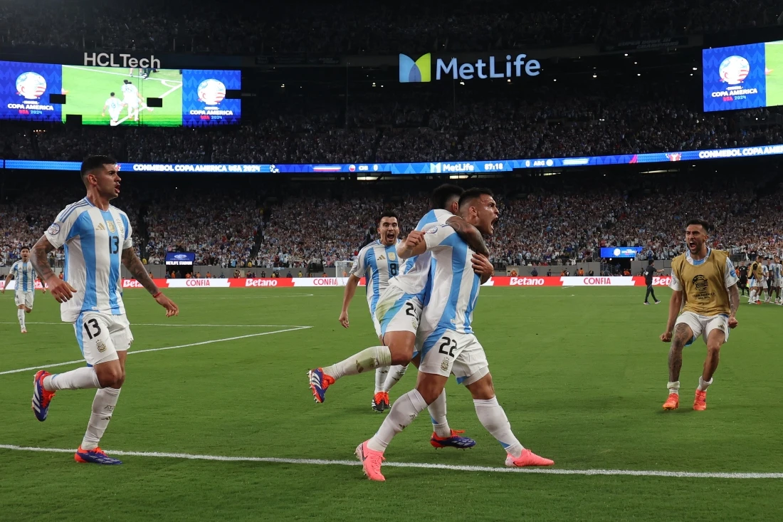 Lautaro Martinez of Argentina celebrates after scoring the team's first goal during the CONMEBOL Copa America 2024 match between Chile and Argentina at MetLife Stadium on Tuesday in East Rutherford, New Jersey. (GETTY IMAGES NORTH AMERICA /AFP)