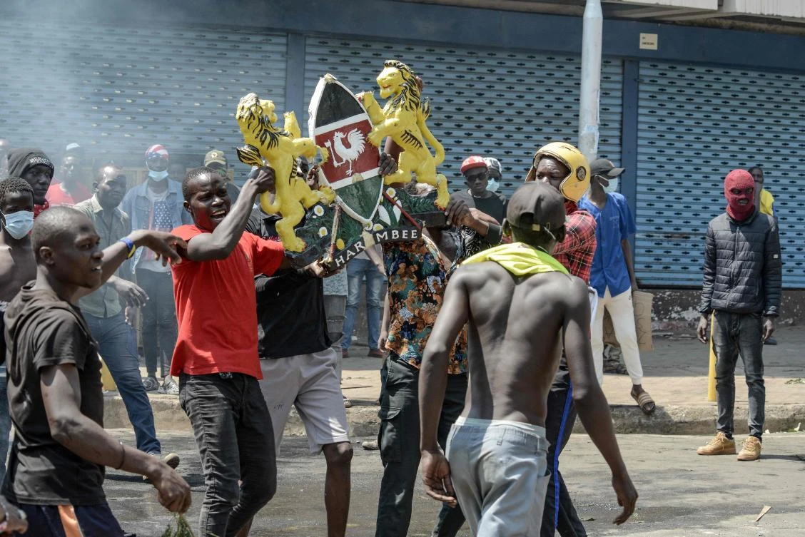 Demonstrators react during a nationwide strike to protest against tax hikes and the Finance Bill 2024 in Kisumu, western Kenya, on June 25, 2024. (AFP)