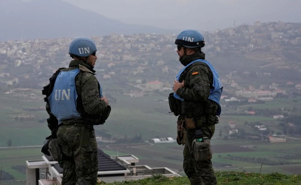 Spanish UN peacekeepers stand on a hill overlooking the Lebanese border villages with Israel in Marjayoun town, Jan. 10, 2024. (AP Photo)