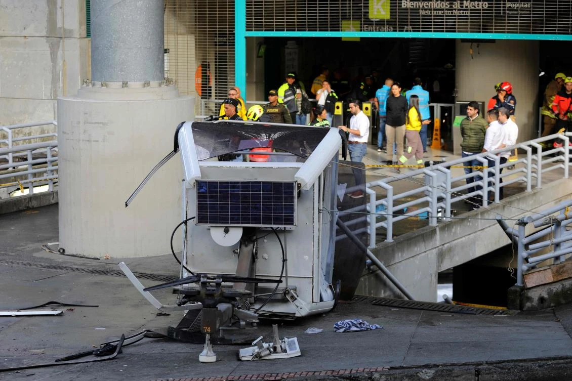 Police officers guard the site where a Metrocable cable railway cabin fell after derailing at one of the stations in Medellin, Colombia, on Jun. 26, 2024. (AFP)
