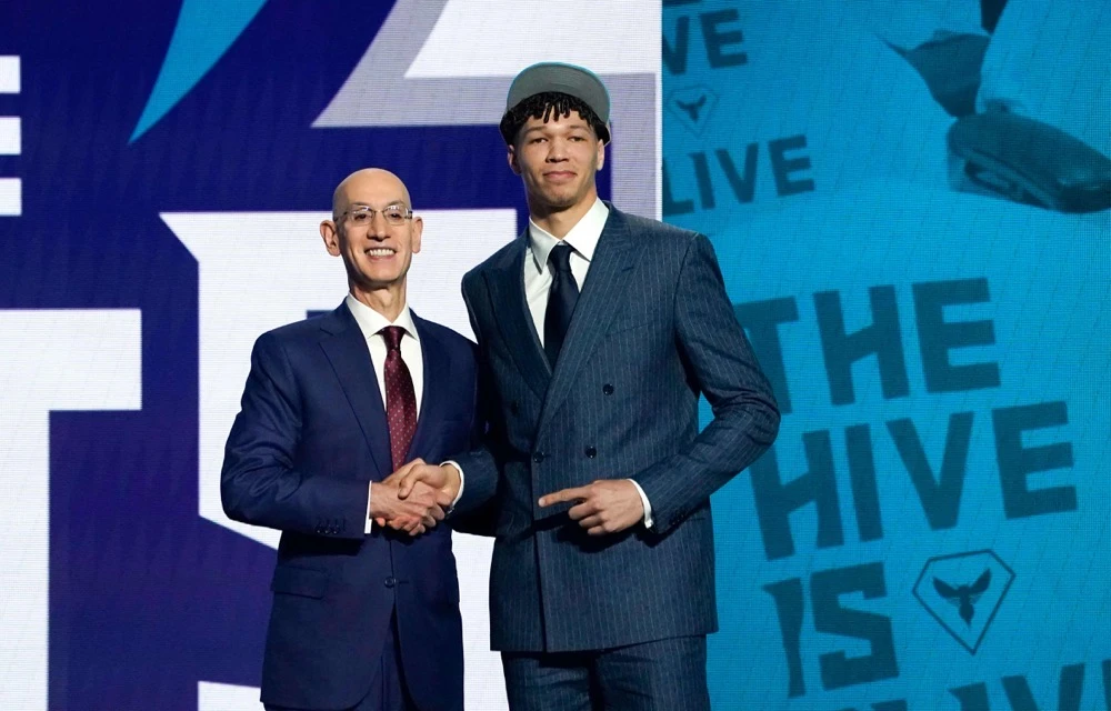 Adam Silver, Commissioner of the National Basketball Association (NBA), poses with French basketball player Tidjane Salaun (R) during Round One of the 78th edition of the NBA's annual draft at Barclays Center in Brooklyn, on June 26, 2024. (AFP)