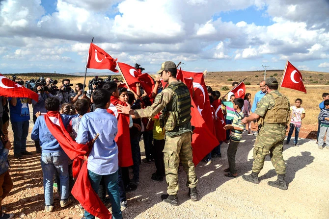A senior Turkish military officer with the rank of a brigadier general has been detained on suspicion of human trafficking across the Syrian border, defence ministry sources said on Thursday. (AFP/File)