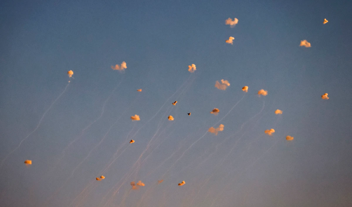 Rockets fired from southern Lebanon are intercepted by Israel’s Iron Dome air defense system over the Upper Galilee region in northern Israel on June 27, 2024. (AFP/File)