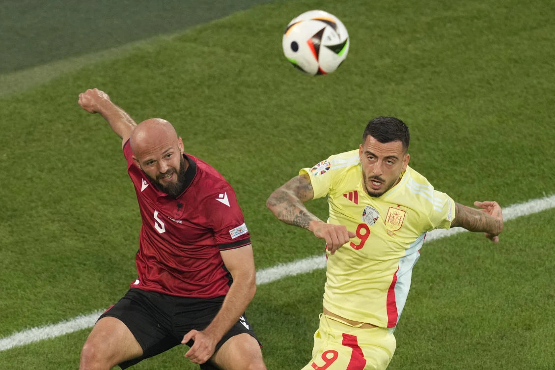 Spain’s Joselu, right, challenges for the ball with Albania’s Arlind Ajeti during their Group B match at the Euro 2024 tournament in Duesseldorf on Jun. 24, 2024. (AP)
