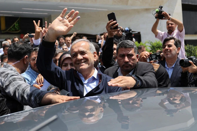 Presidential candidate Masoud Pezeshkian waves to supporters on the day of the presidential election to choose a successor to Ebrahim Raisi following his death in a helicopter crash, in Tehran, Iran June 28, 2024. (REUTERS)