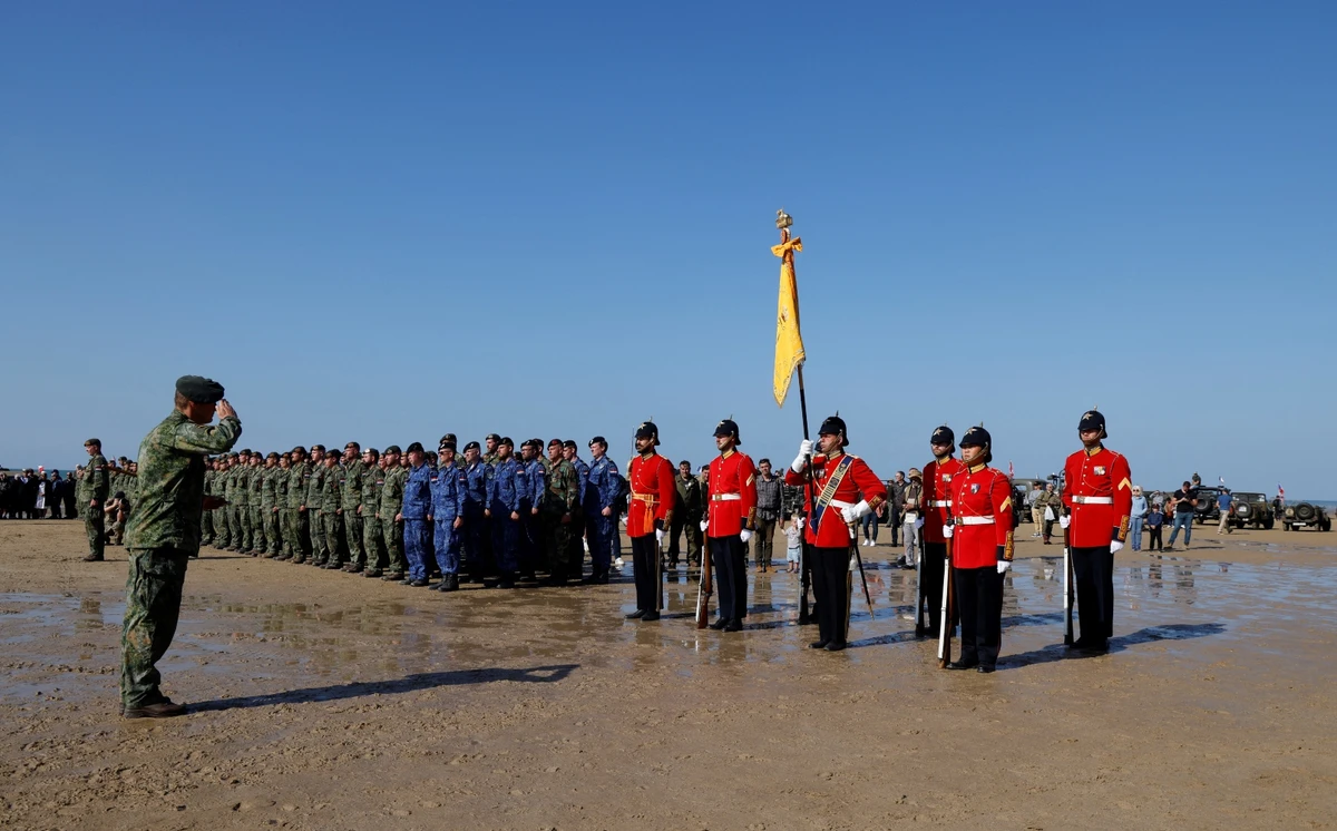 Troops take part in the D-Day commemorations marking the 80th anniversary of the WWII Allied landings in Normandy (AFP)