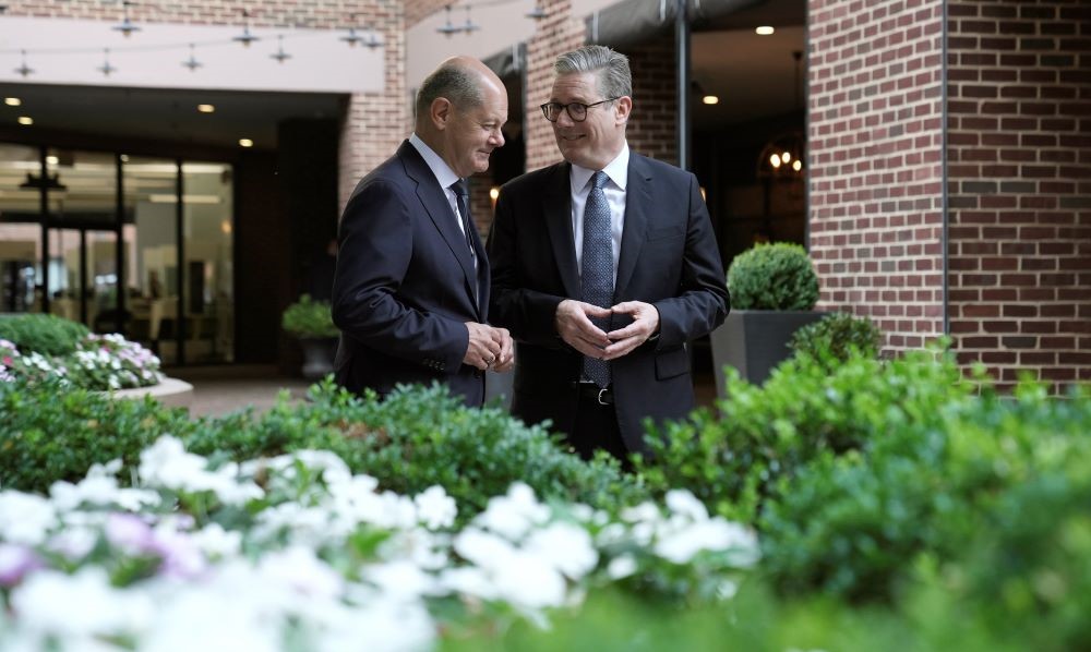 Keir Starmer, right, speaks with Olaf Scholz ahead of the NATO summit, Washington, July 10, 2024. (AP Photo)