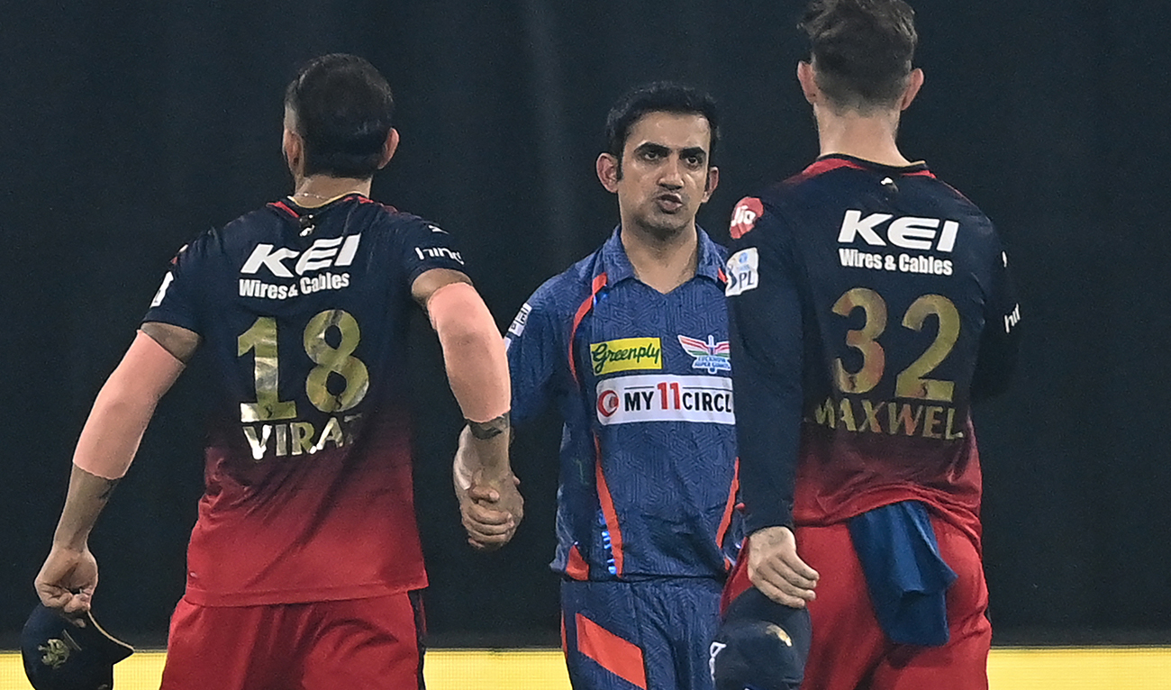 Lucknow Super Giants' team mentor Gautam Gambhir (C) shakes hands with Royal Challengers Bangalore's Virat Kohli (L) and Glenn Maxwell (R) at the end of the Indian Premier League (IPL) Twenty20 cricket match between Lucknow Super Giants and Royal Challengers Bangalore at the Ekana Cricket Stadium in Lucknow on May 1, 2023. (AFP/File)