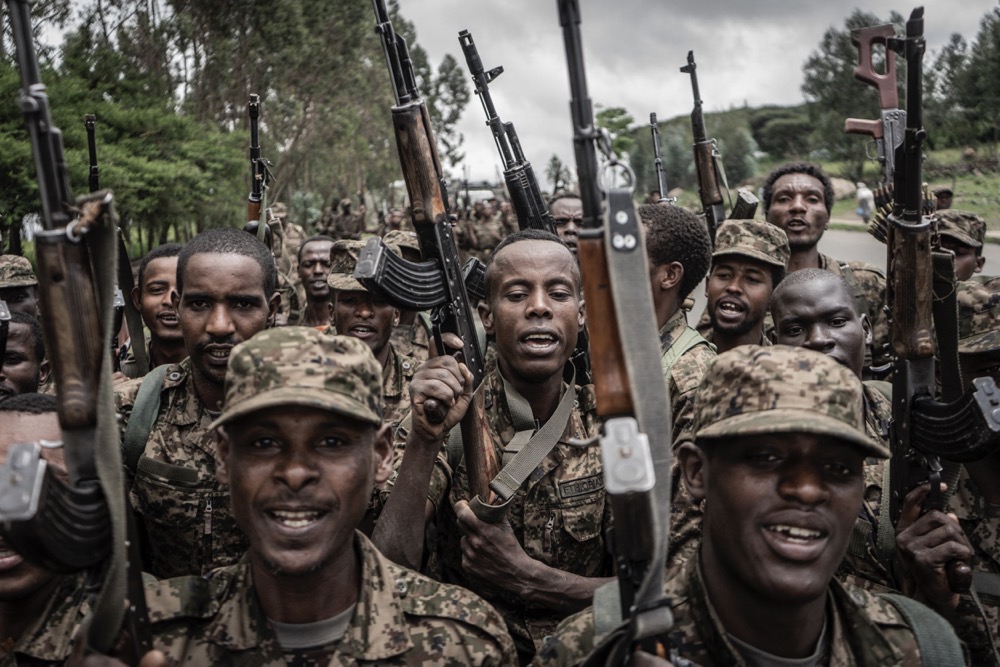 Ethiopian National Defence Forces soldiers shout slogans after finishing their training in the city of Gondar. (AFP)
