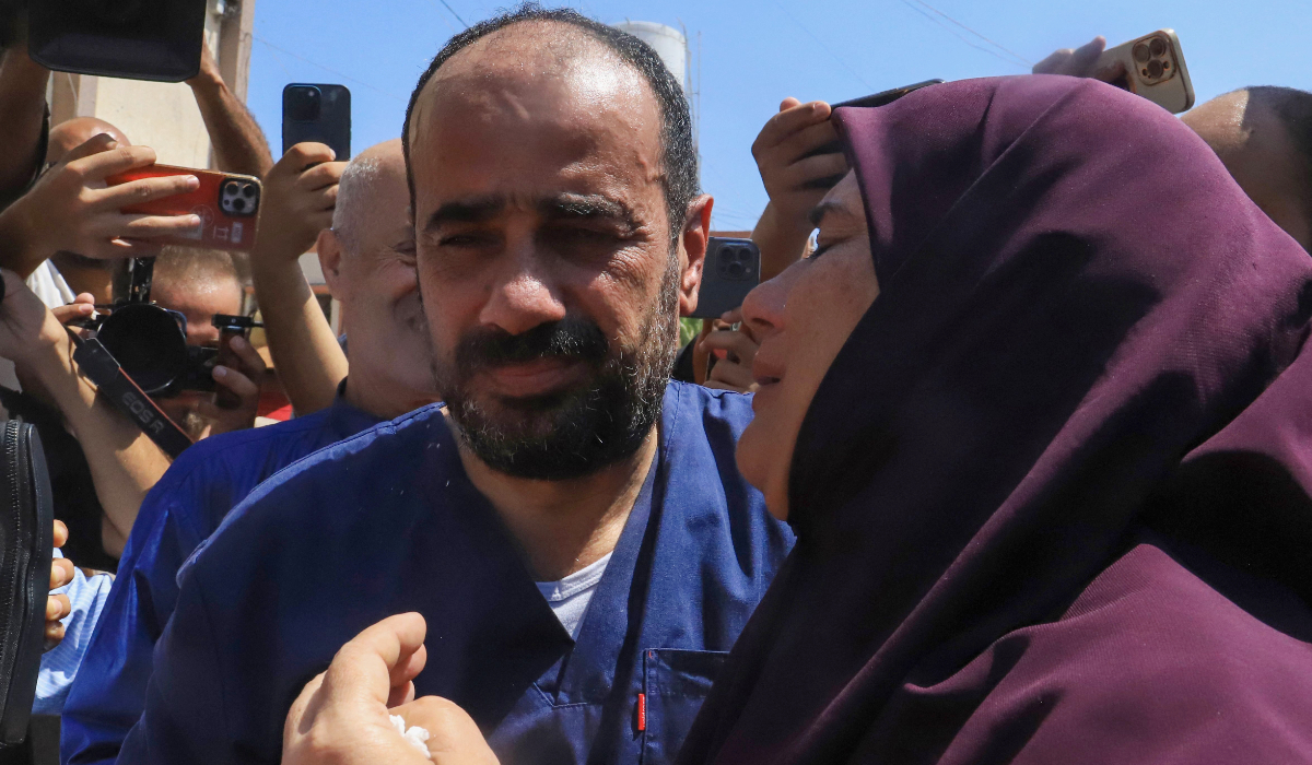 Al-Shifa hospital director Mohammed Abu Salmiya who was detained by Israeli forces since November, is welcomed by relatives after his release alongside other detainees, at Nasser hopsital in Khan Yunis in the southern Gaza Strip July 1, 2024, amid the ongoing conflict between Israel and the Palestinian Hamas militant group. (AFP)