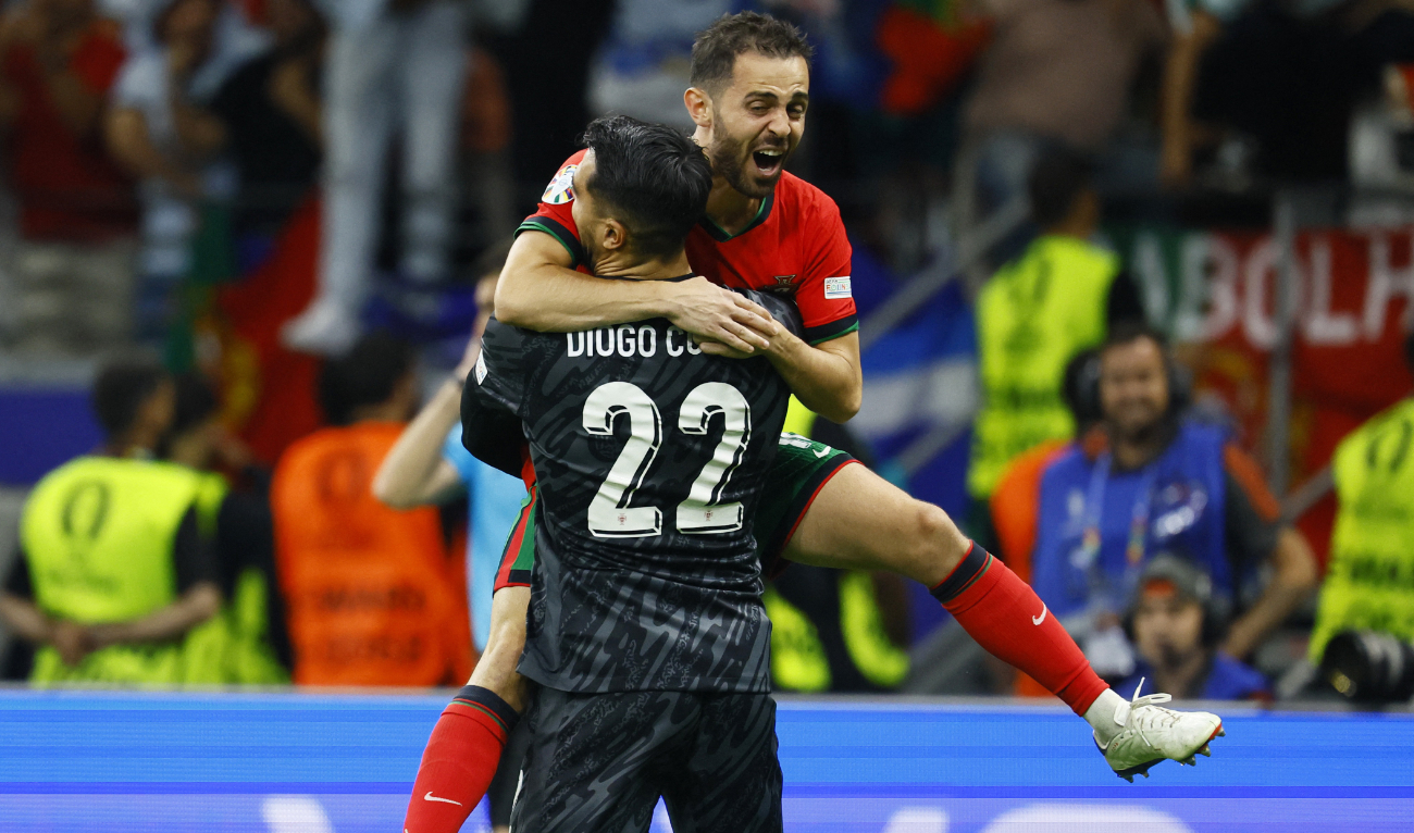 Portugal’s Diogo Costa celebrates with Bernardo Silva after winning the penalty shootout against Slovenia at Frankfurt Arena, Frankfurt, Germany on July 1, 2024. (Reuters)