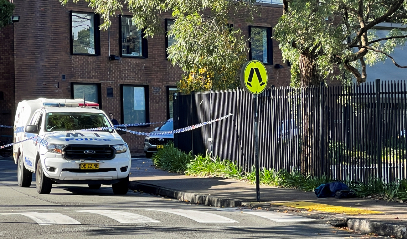A police vehicle is seen at the scene after a 14-year-old boy was arrested and a 22-year-old man was taken to hospital following a stabbing incident at the University of Sydney in Camperdown, Australia, July 2, 2024. (Reuters)