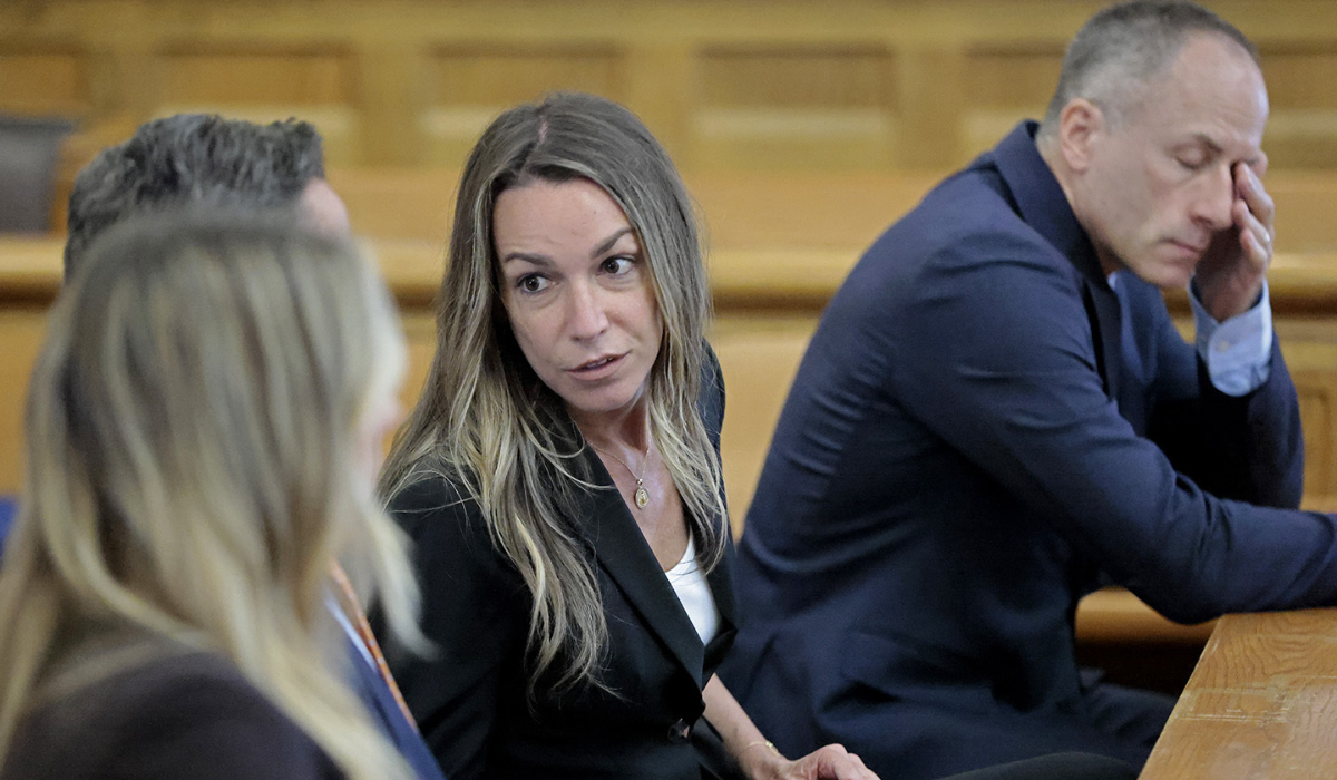Karen Read talks with her legal team at the Norfolk Superior Court in Dedham, Mass., Monday, July 1, 2024. (AP)