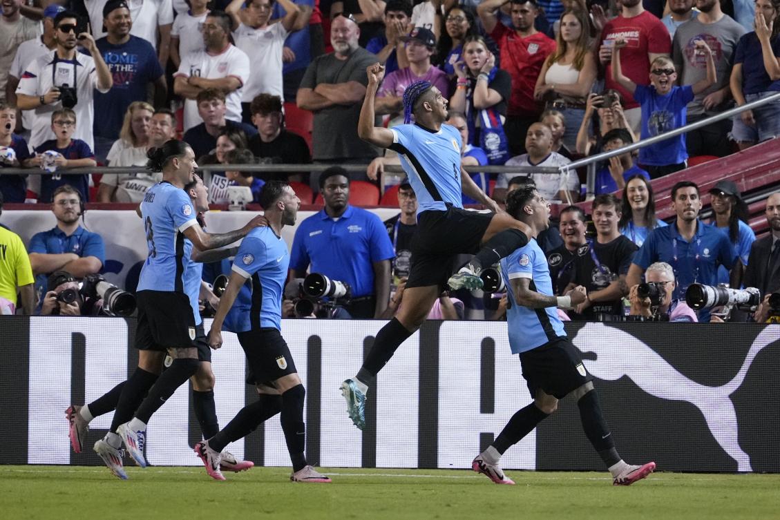 Uruguay players celebrate after scoring a goal during their Copa America Group C match against the United States on July 1, 2024, in Kansas City, Missouri. (AP)
