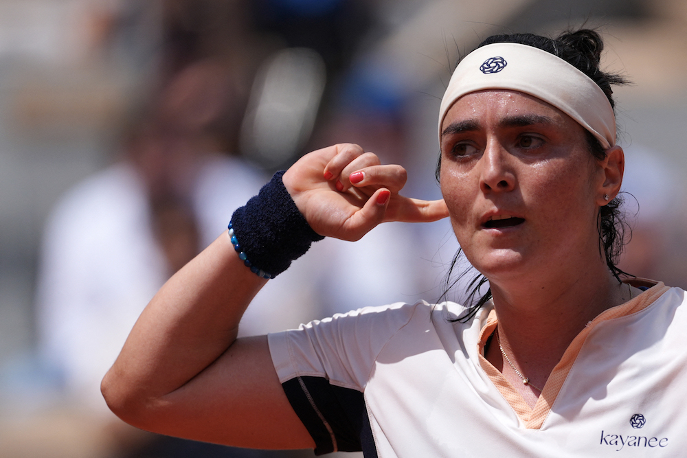 The Tunisian history-maker has enjoyed remarkable success but also suffered her greatest disappointments on Wimbledon’s center court. (AFP)