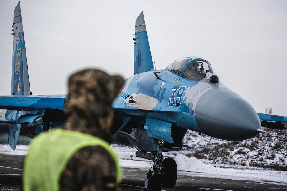 Above, a Sukhoi Su-27 fighter jet preps for a flight at the Myrhorod airfield in Ukraine’s Poltava region on Feb. 11, 2022. (Ministry of Defense Ukraine/AFP)