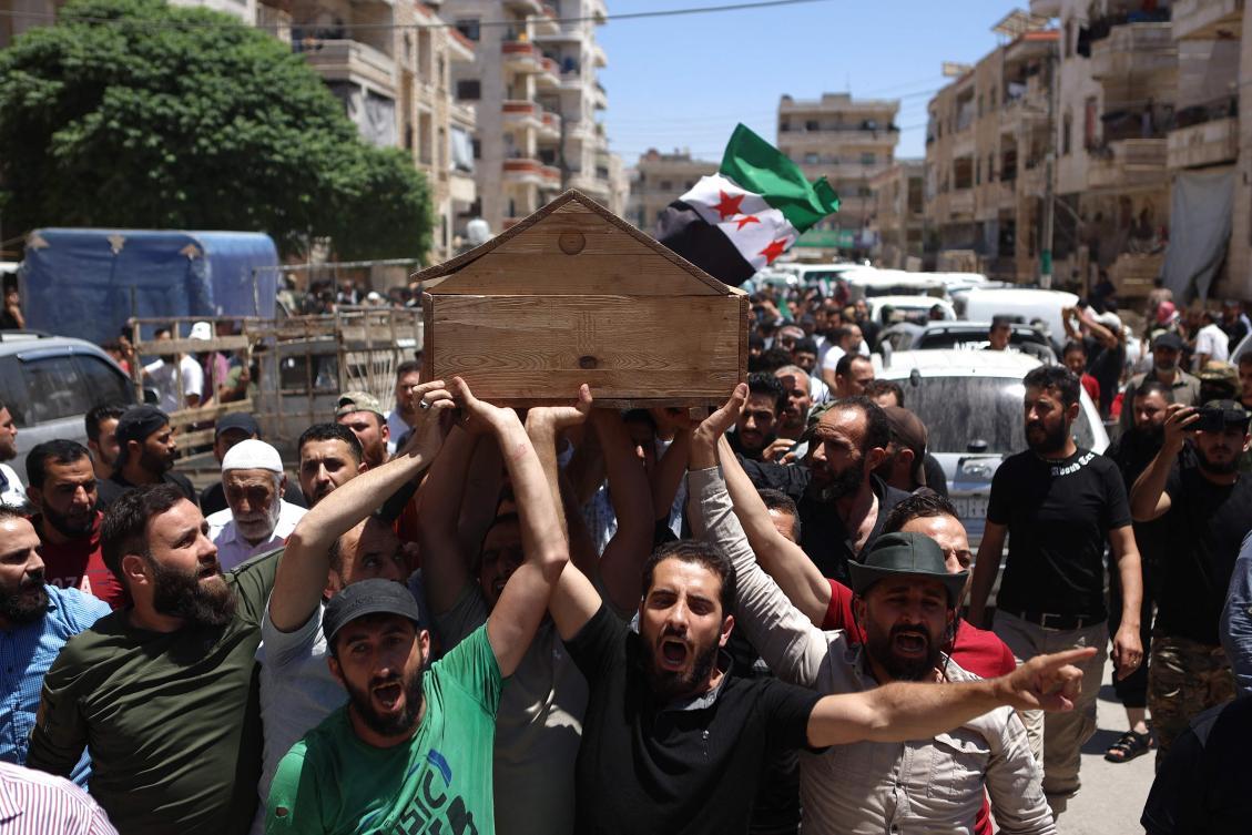 Syrians attend the funeral procession of a man killed during clashes with Turkish troops, Afrin, northern Syria, July 2, 2024. (AFP)