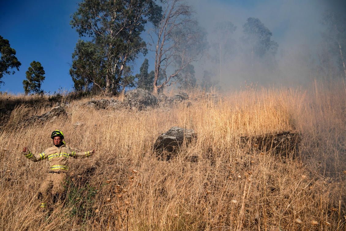 An Israeli firefighter works following over border rockets launching to Israel from Lebanon, amid ongoing cross-border hostilities between Hezbollah and Israeli forces, outside Kiryat Shmona in northern Israel July 2, 2024. (Reuters)