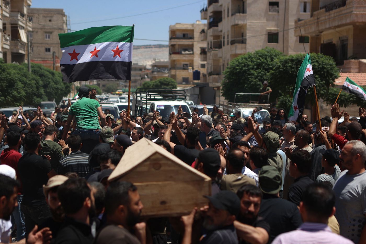 Syrians take part in the funeral procession of a man killed during clashes with Turkish troops, in Afrin in northern Syria on July 2, 2024. (AFP)