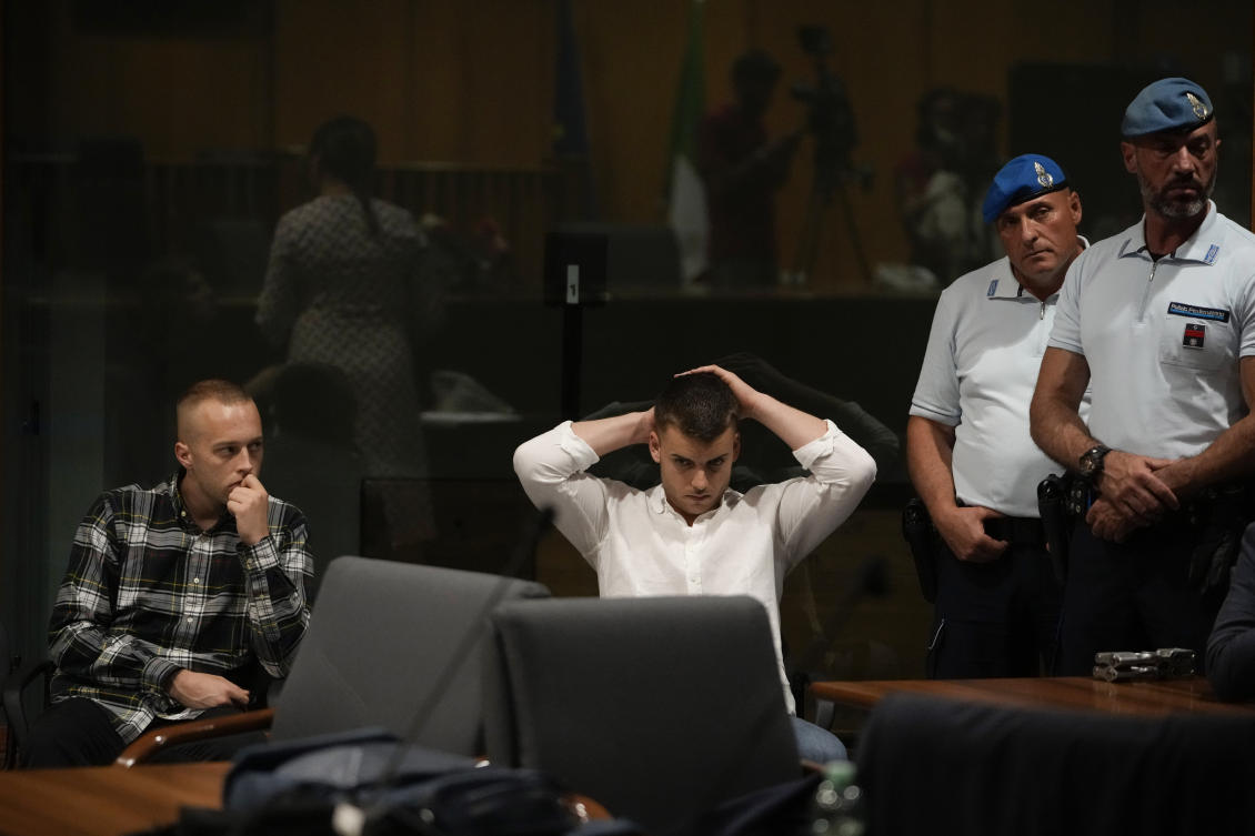 Finnegan Lee Elder, left, and Gabriel Natale Hjorth, sit before the reading of the judgment at the end of a hearing for the appeals trial in which they are facing murder charges for killing Italian Carabinieri paramilitary police officer Mario Cerciello Rega, in Rome, on Jul. 3, 2024. (AP)