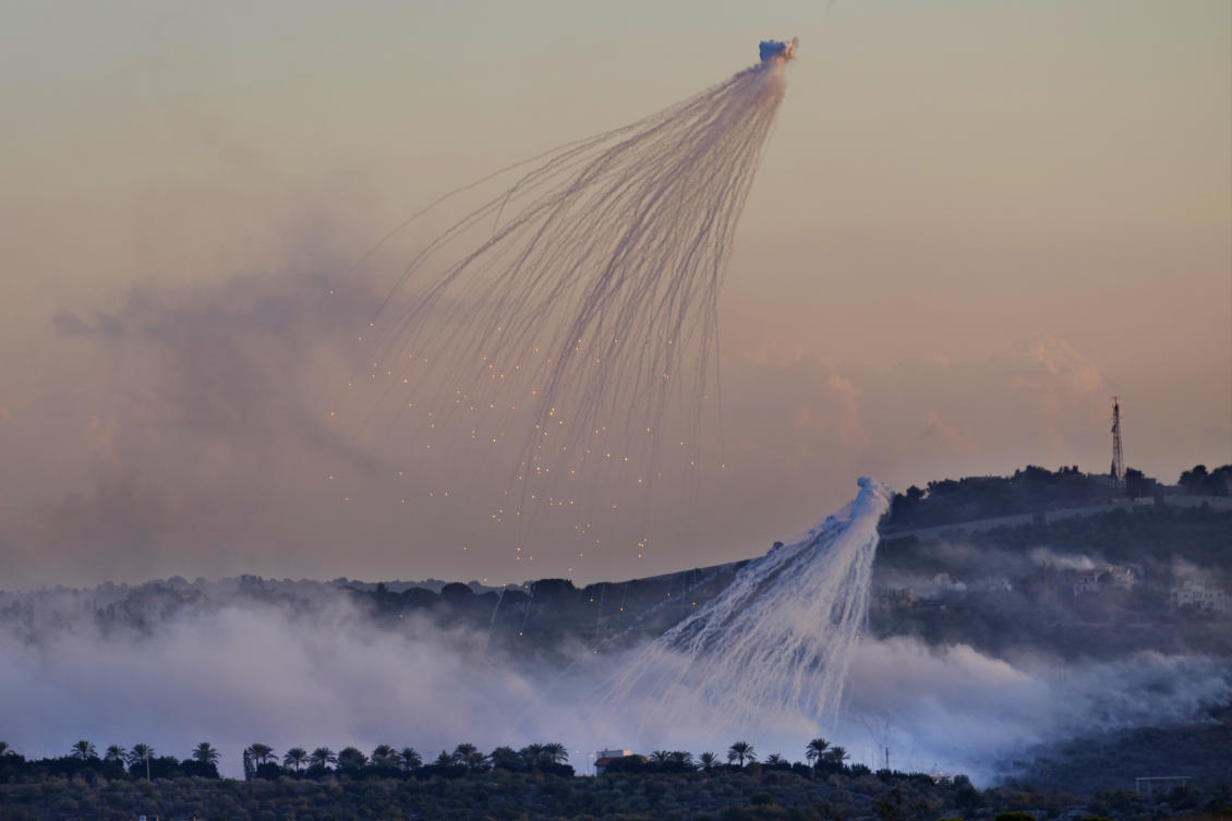 Shells that appears to be white phosphorus from Israeli artillery explode over Dahaira, a Lebanese border village with Israel (AP)