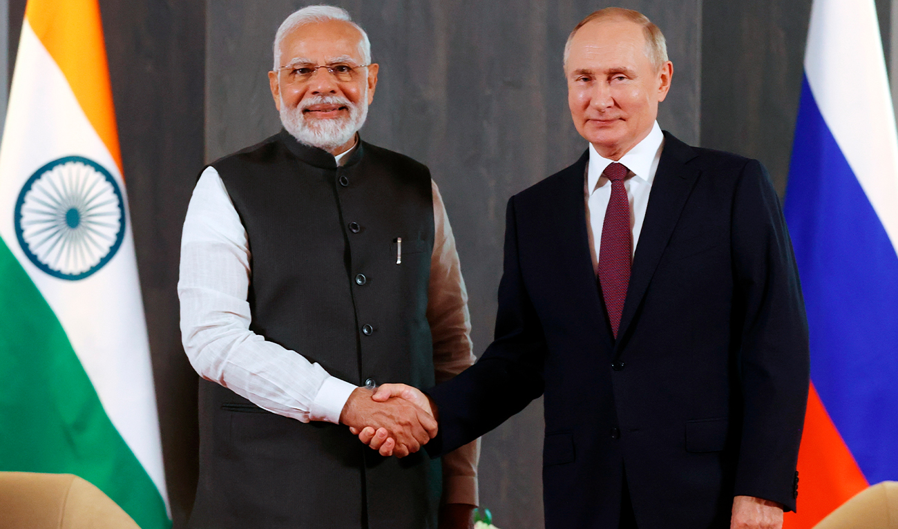 Russian President Vladimir Putin, right, and Indian Prime Minister Narendra Modi pose for a photo shaking hands prior to their talks on the sidelines of the Shanghai Cooperation Organisation (SCO) summit in Samarkand, Uzbekistan, on Sept. 16, 2022. (Kremlin Pool Photo via AP, File)