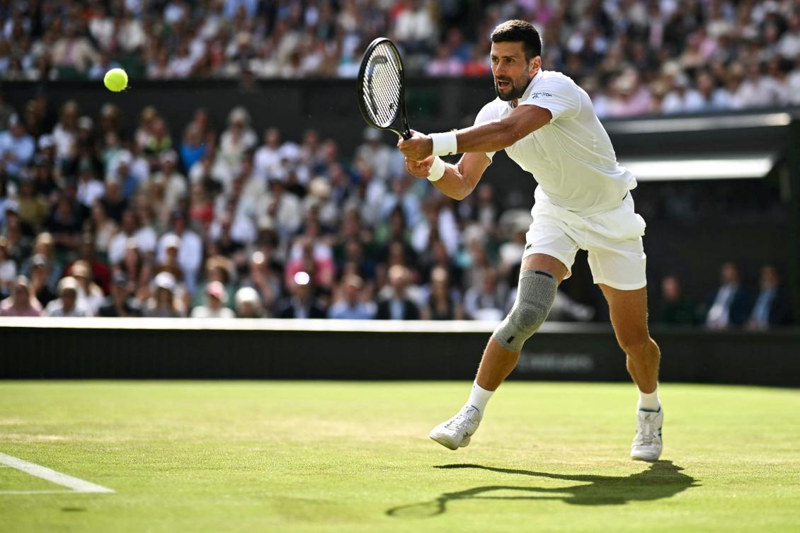 Djokovic into Wimbledon third round after rookie scare