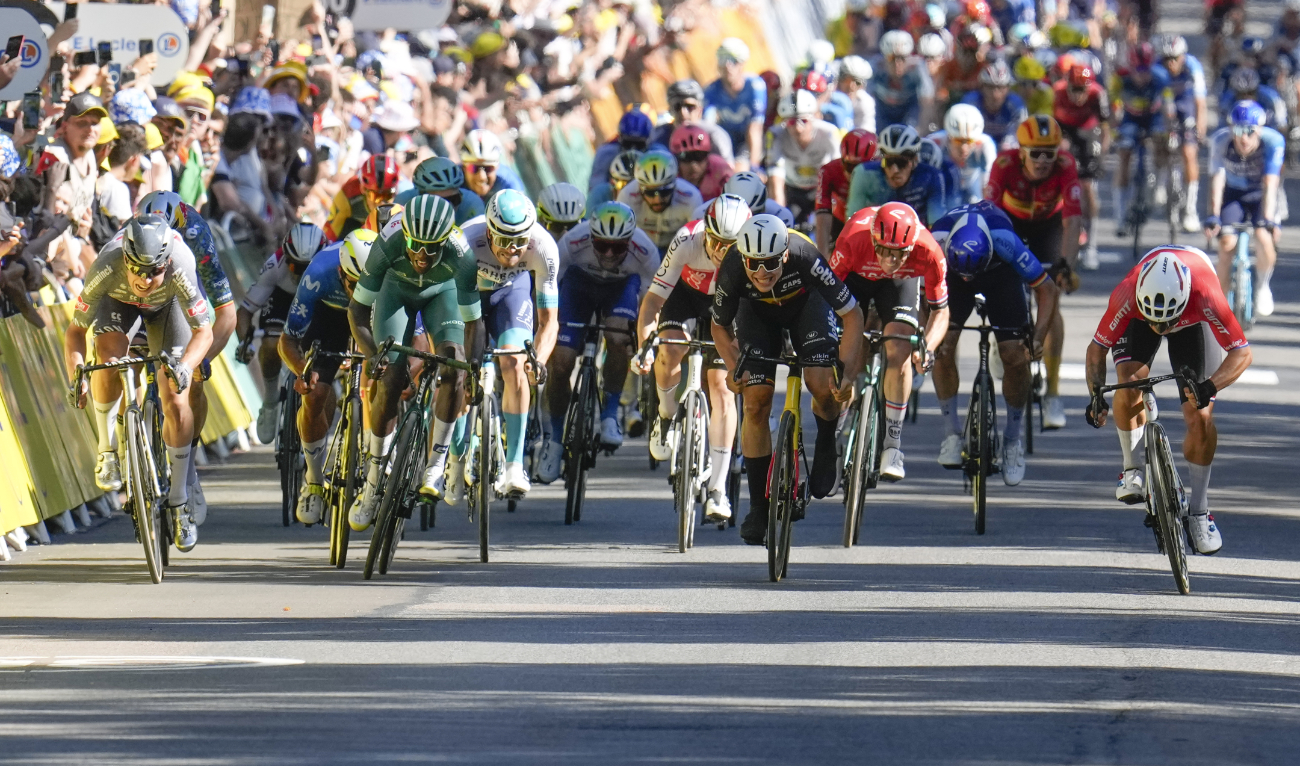 Netherlands' Dylan Groenewegen, far right, sprints to the finish line to win ahead of Belgium's Jasper Philipsen, far left, Eritrea's Biniam Girmay, left, and Belgium's Arnaud de Lie, third from right, during the sixth stage of the Tour de France cycling race Thursday. (AP)
