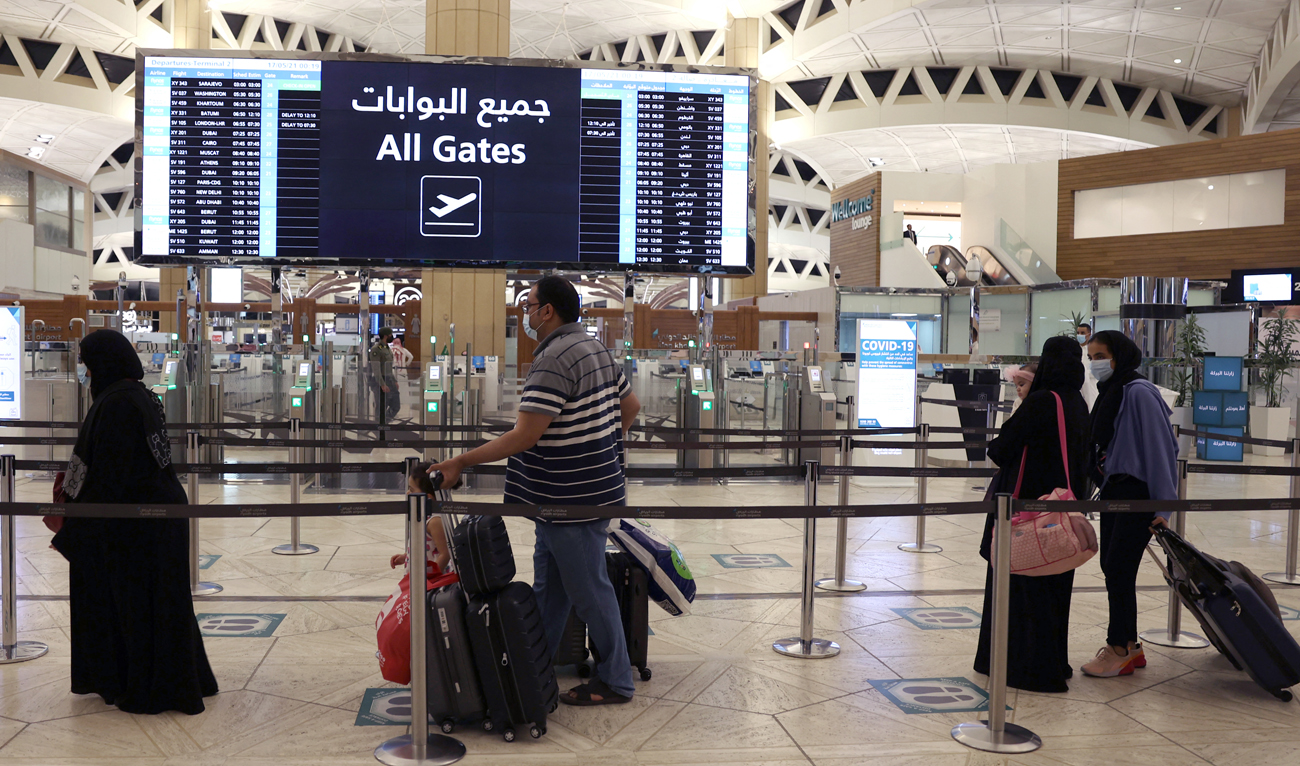 This file photograph, taken on May 17, 2021, shows Saudi passengers arriving at the King Khaled International airport in the capital Riyadh. (AFP/File)