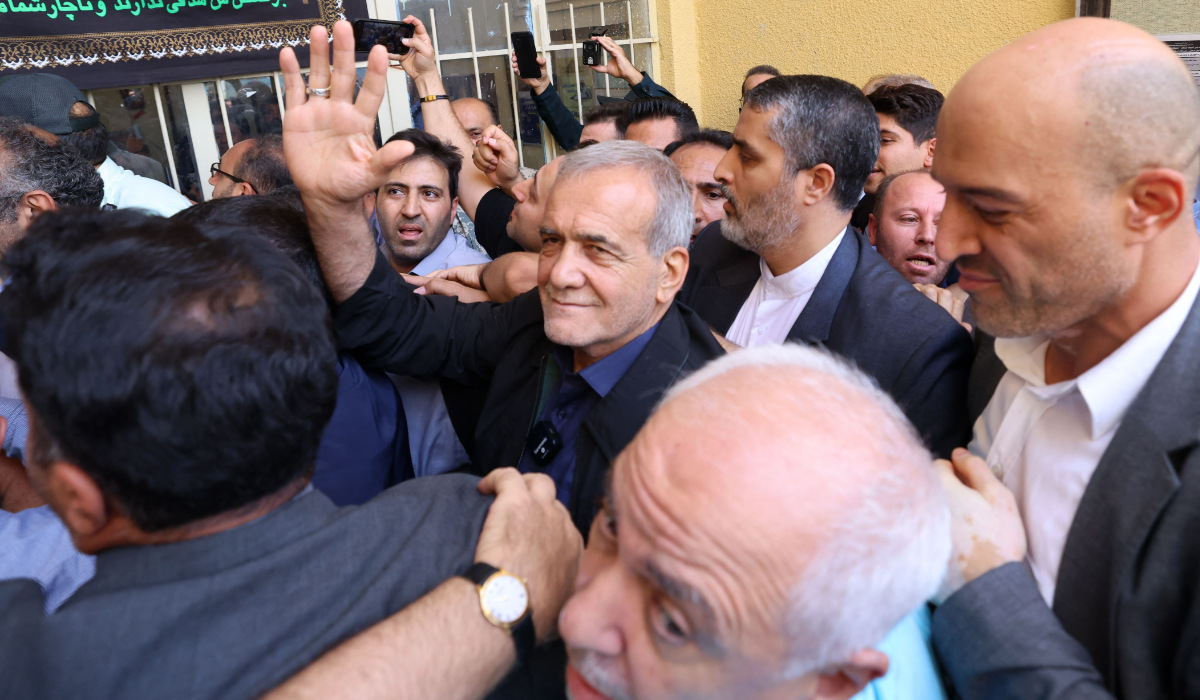 Iranian reformist presidential candidate Masoud Pezeshkian (C) gestures after voting in Tehran on July 5, 2024. (AFP)