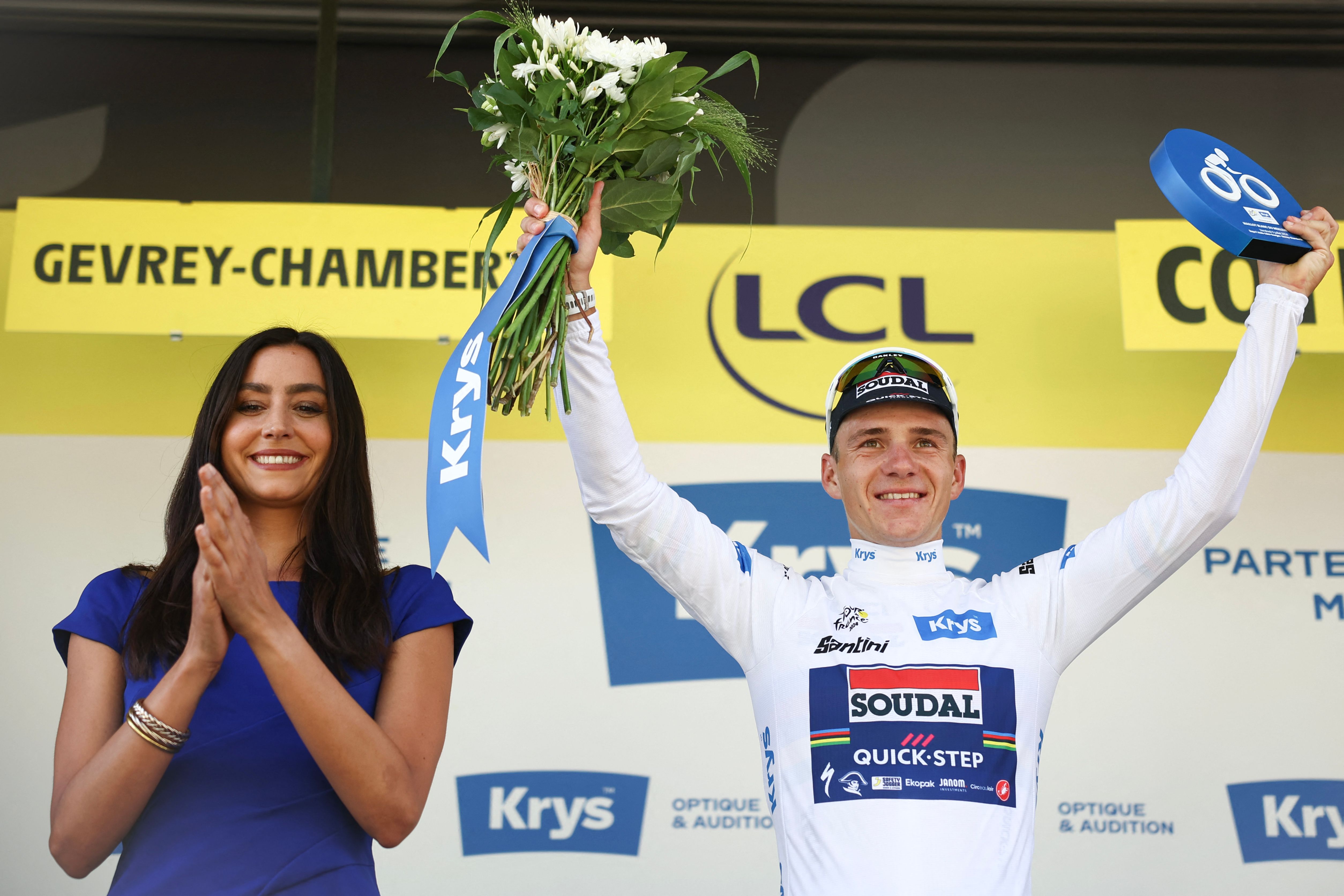 Soudal Quick Step team's Belgian rider Remco Evenepoel celebrates on the podium with the best young rider's white jersey after the 7th stage of the Tour de France cycling race on July 5, 2024. (AFP)