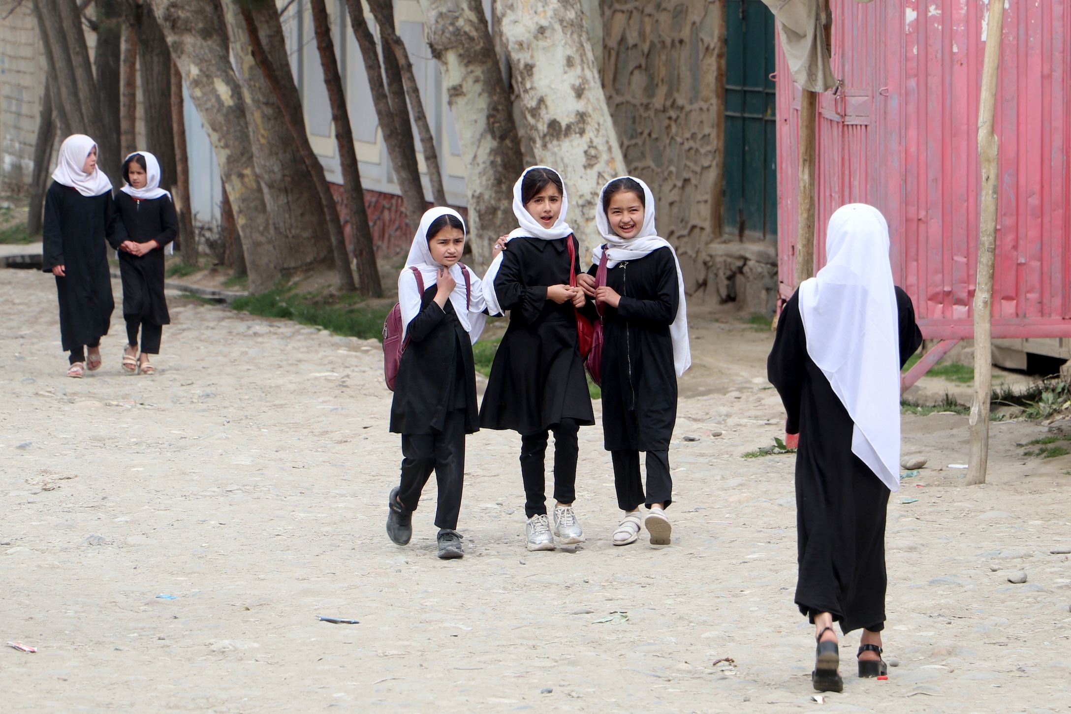 Afghan primary school girls walk to their school in Fayzabad district, Badakhshan province on March 20, 2024. Secondary schools have been suspended since 2021. (AFP)