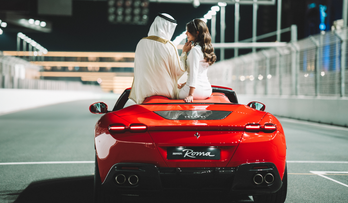 The Saudi newlyweds recently made their first entrance as husband and wife on a red 2024 Ferrari Roma Spider waving to their guests and driving across the Jeddah Corniche Circuit. (Supplied)