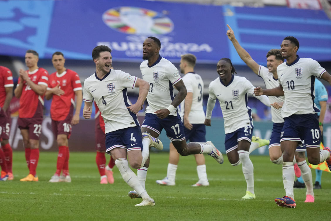England players celebrate after Trent Alexander-Arnold scored their winning goal during the penalty shootout of a quarterfinal match against Switzerland at the Euro 2024 in Duesseldorf, Germany, on Jul. 6, 2024. (AP)