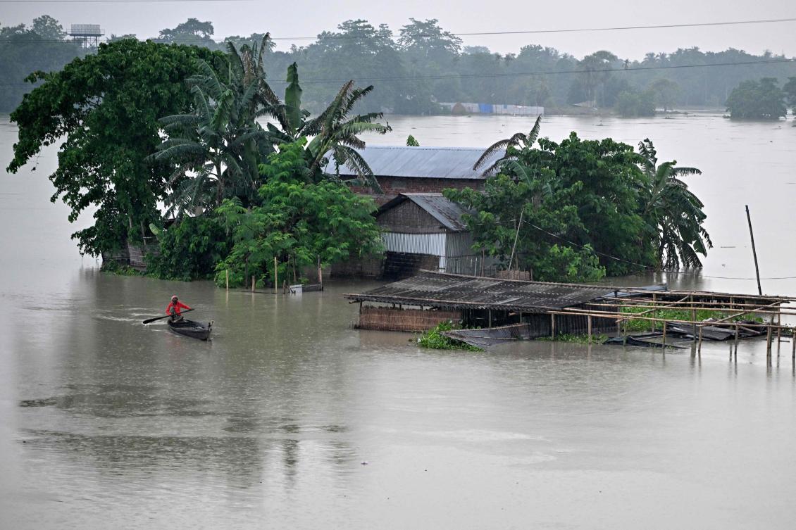 Many streets were under water in the coastal city after hours of heavy rain, with several bus and train services suspended. (AFP)